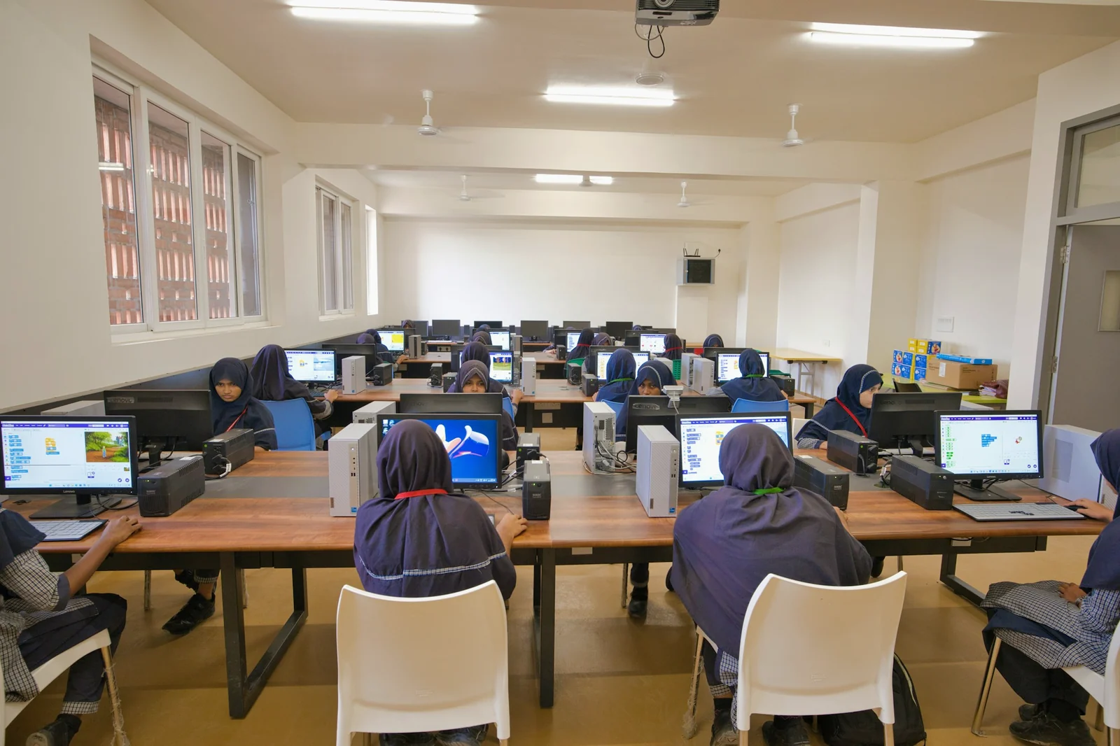 Students learning at desktop computers in an Indian school lab