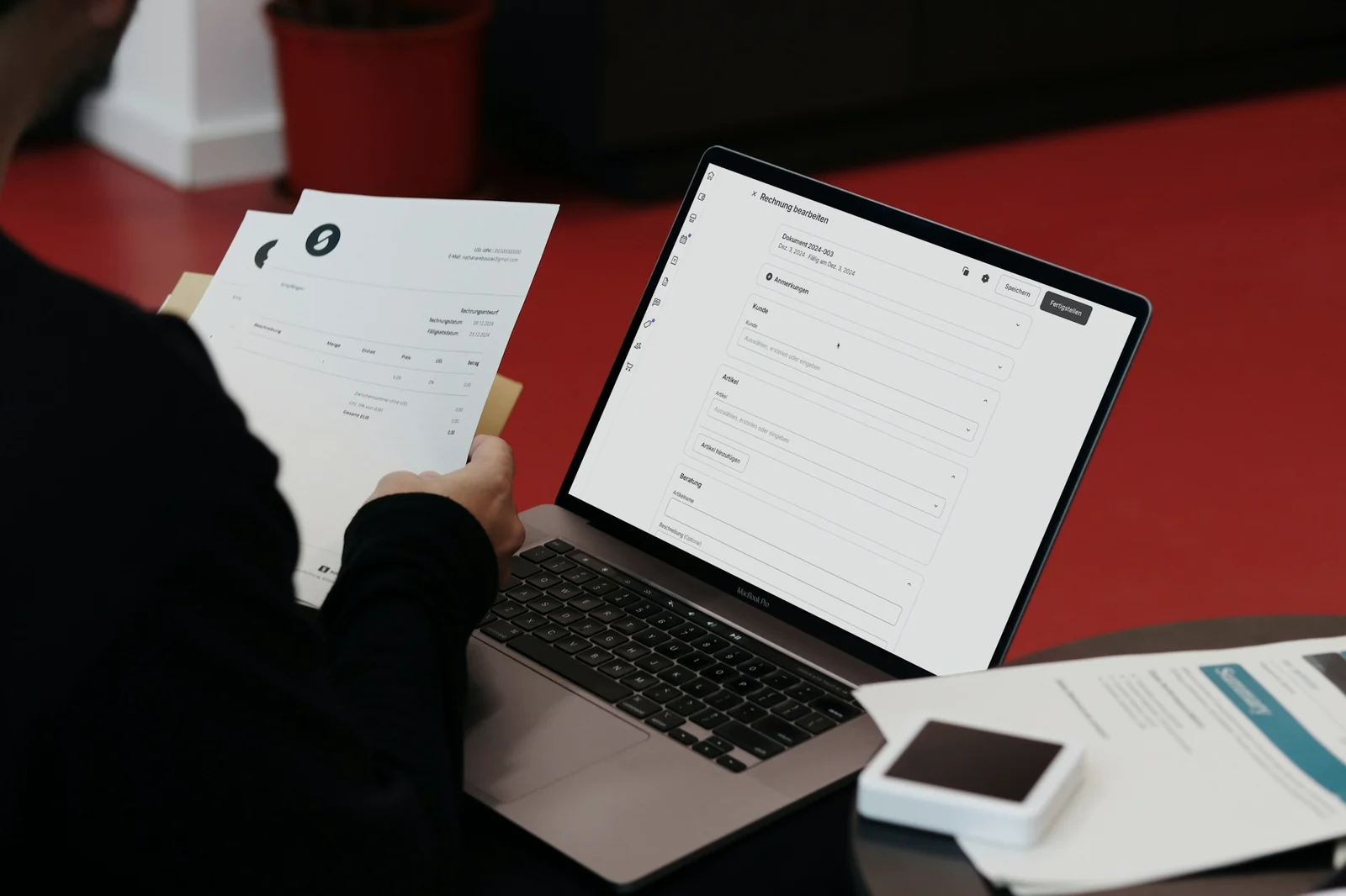 Founder reviewing financial information at a desk