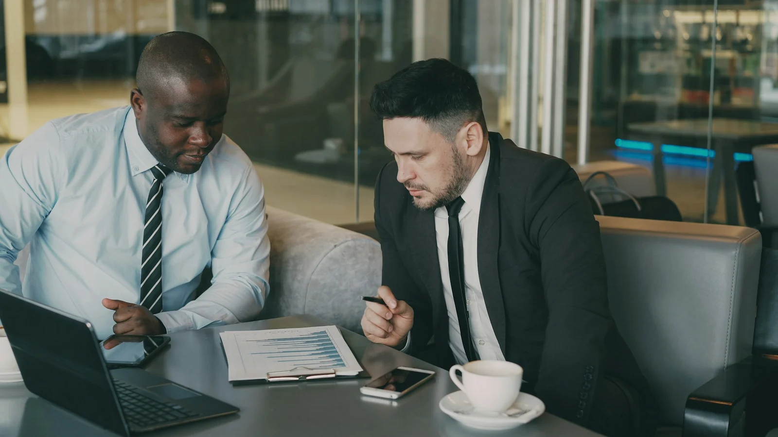 Focused business discussion around a meeting table